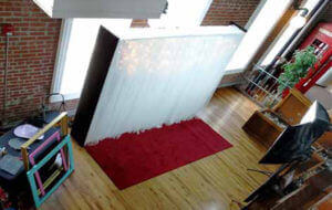White backdrop red carpet photo booth rental Kansas City