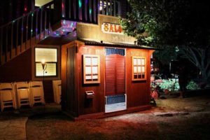 Rustic vintage western saloon photo booth at night.