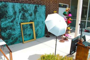 Outdoor red carpet high school backdrop photo booth rental shoot