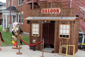 Outdoor rustic western saloon photo booth wedding rental event.
