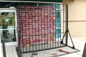 Jail bars prison brick backdrop photo booth rental