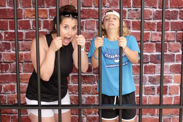 Brick jail cell bars for photo booth party rental