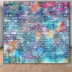 Colorful brick and stone wall of graffiti backdrop.