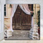 Wooden rustic doors with white draped valance photo booth backdrop