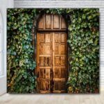Wooden rustic garden doors with ivy covered walls